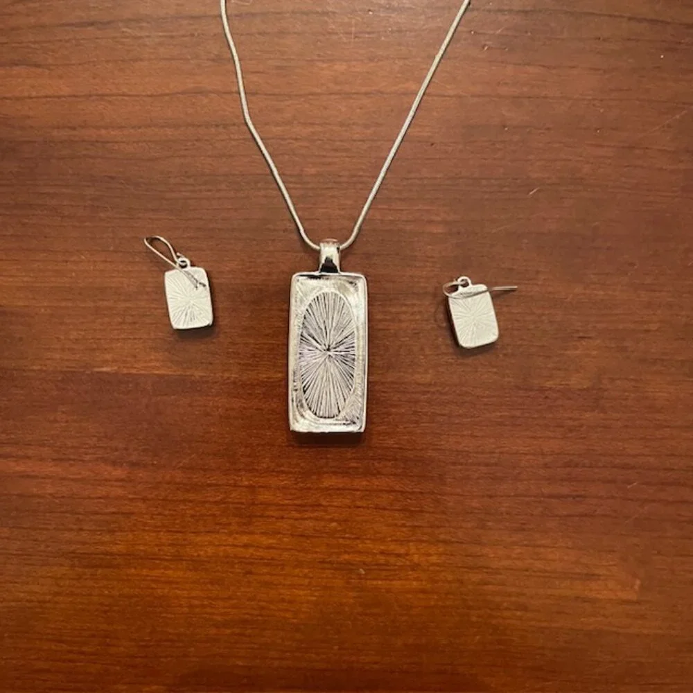 Aqua blue glass pendant and silver tone chain with matching earrings